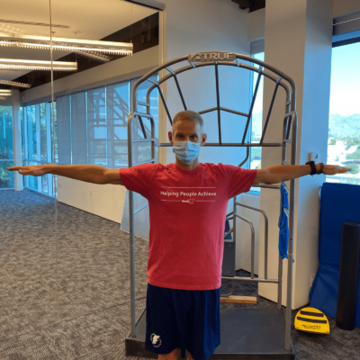 A man demonstrating arm circles.