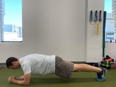 A man doing a standard plank.