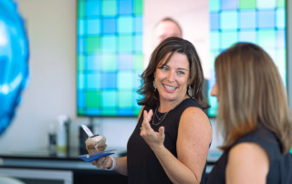 Michelle Babcock talking with a colleague.