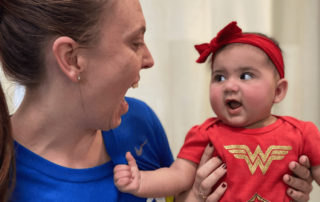 child with torticollis and therapist