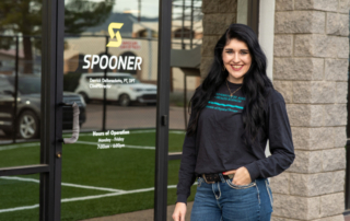 Image of Haley Schlotzhauer standing in front of the Spooner sunnyslope entrance