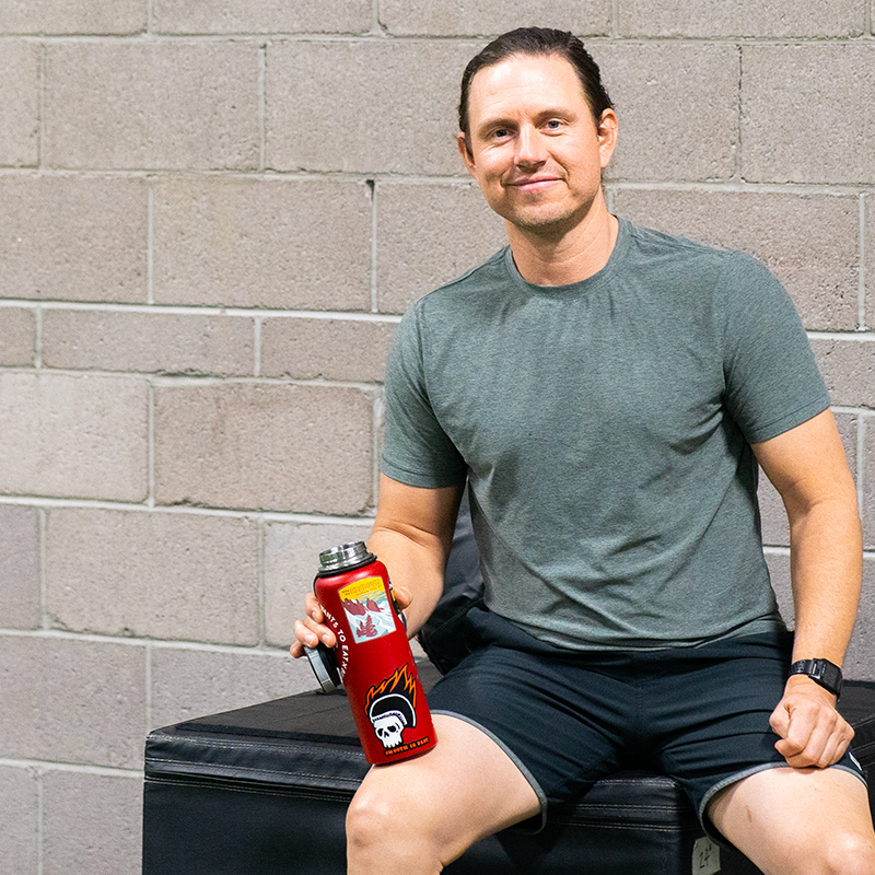 A man holding a water bottle.