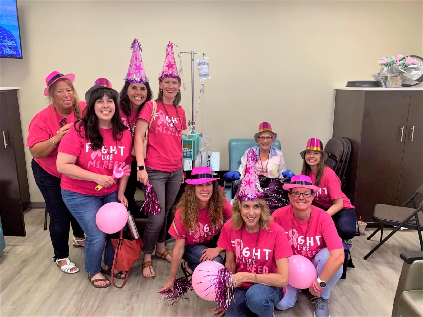 A group photo of women in pink.