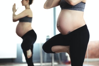 pregnant woman doing yoga