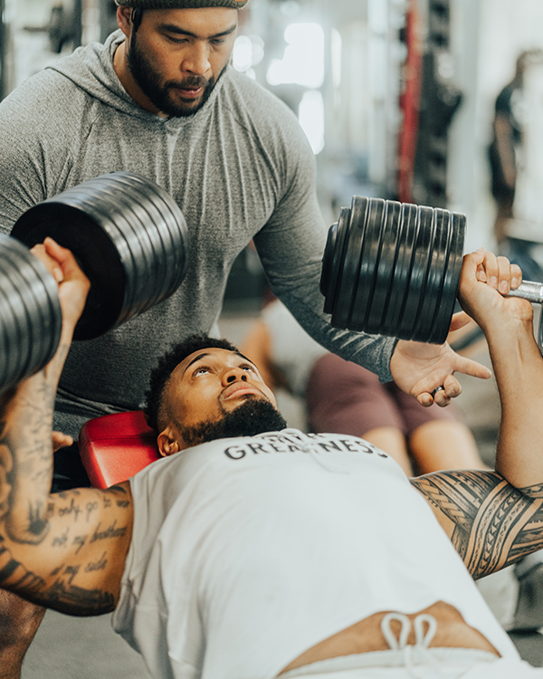 An athlete doing chest presses.